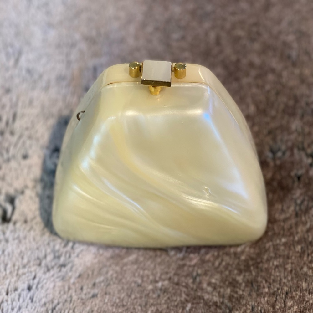 Vintage, ivory, pearlescent, acrylic clutch contemporary triangular silhouette.